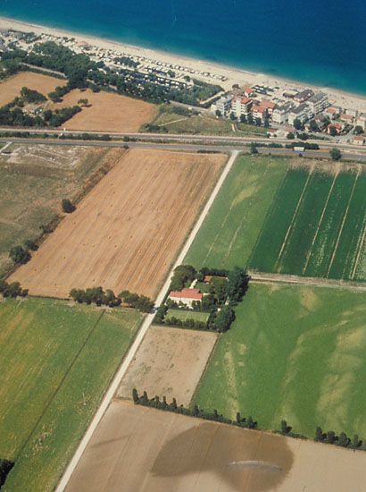 Crop marks of Roman Road with funerary monuments heading towards Potentia.